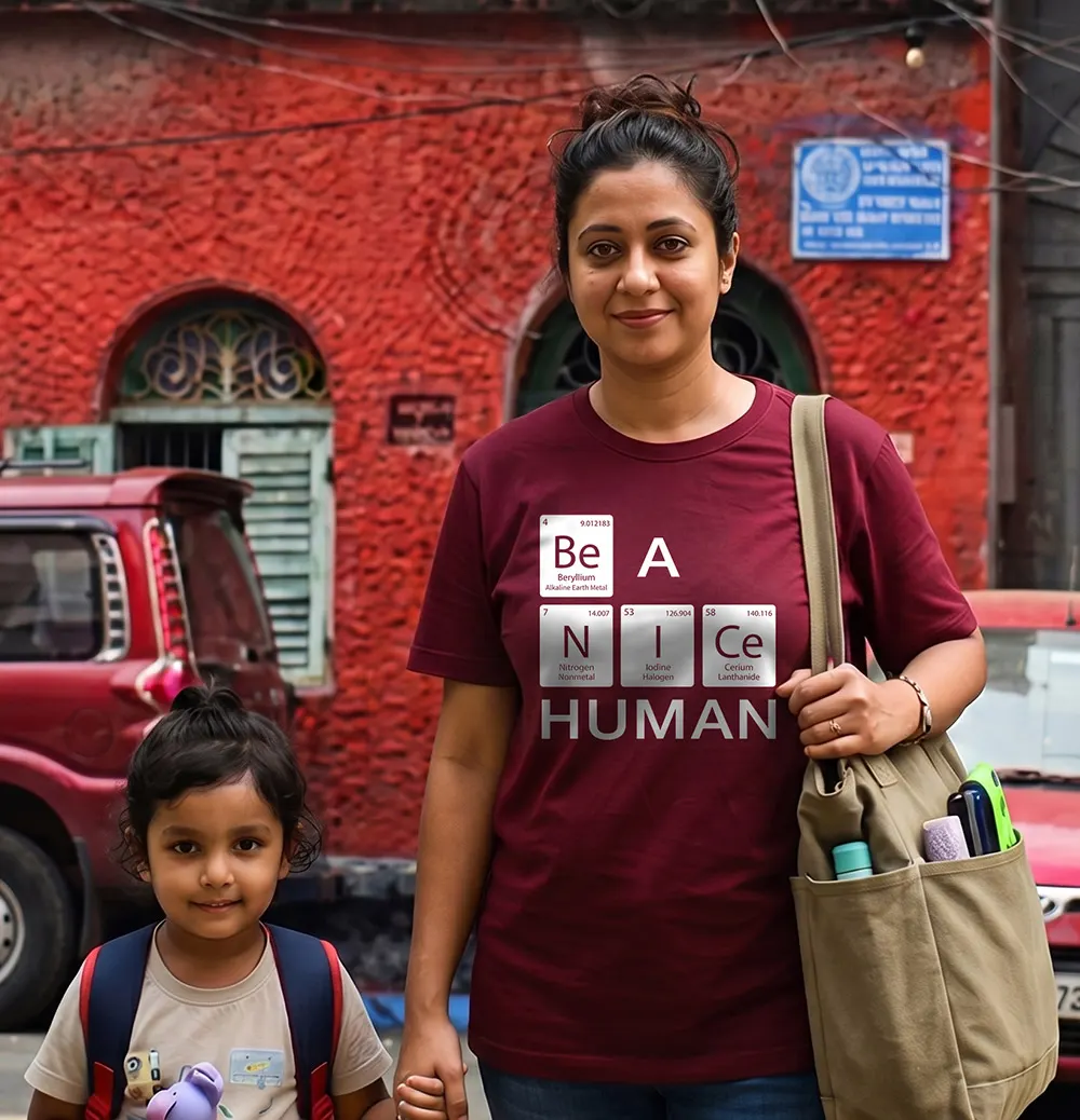 Woman and a mother wearing Be A Nice Human T-shirt and standing