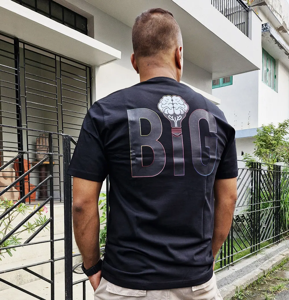 Man wearing Think Big T-shirt back view