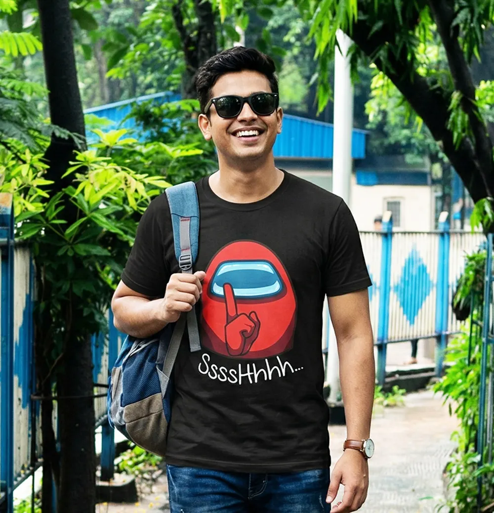 Man wearing an Among Us graphic T-shirt outdoors