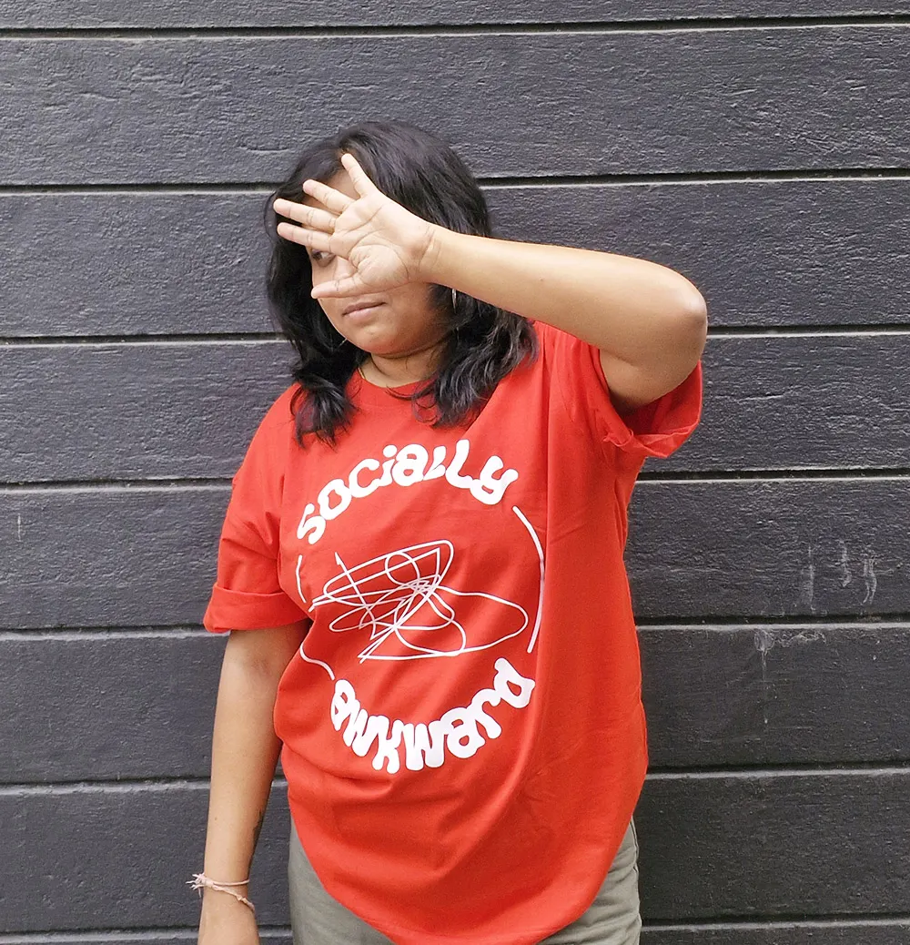 Woman wearing Socially Awkward graphic T-shirt